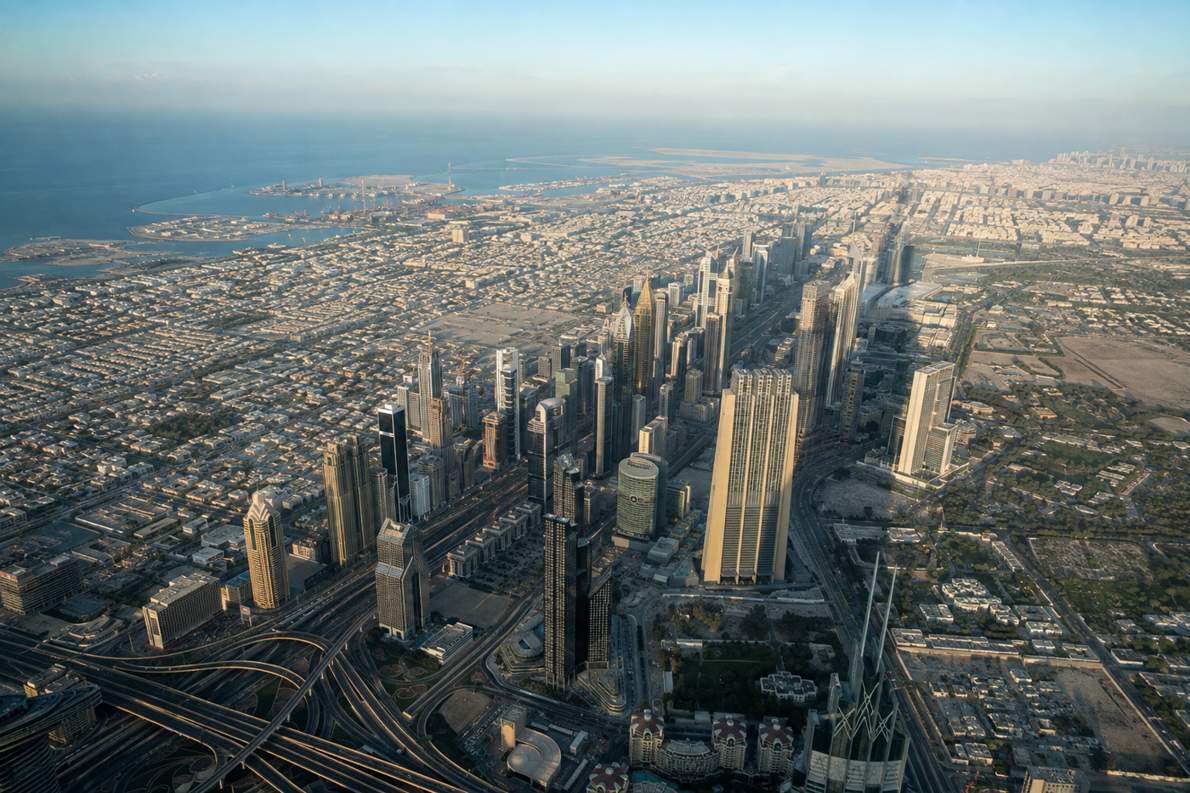 Aerial view from Burj Khalifa observation deck over Sheikh Zayed Road and coastline